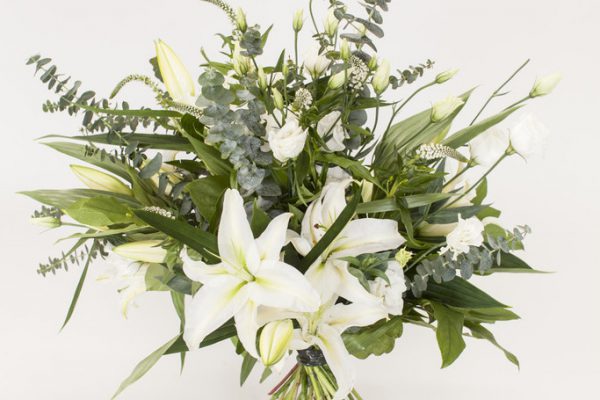 A simple yet elegant hand-tied arrangement of Lilies, Lisianthus, Veronica and greenery. From €60.