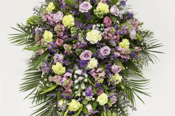 Bells of Ireland, Carnations and Blue Status combined with fresh greenery. A predominantly pink and blue arrangement of Delphiniums, September Flowers, Roses - from €175.