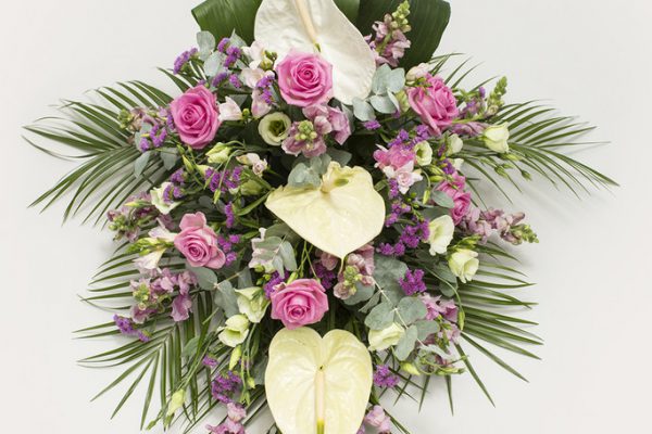 A combination of Anthuriums, Roses, Lisianthus, Stocks and greenery. From €160.