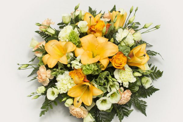 A vibrant arrangement of Lilies, Lisianthus, Bells of Ireland and Carnations, combined with greenery. From €60.