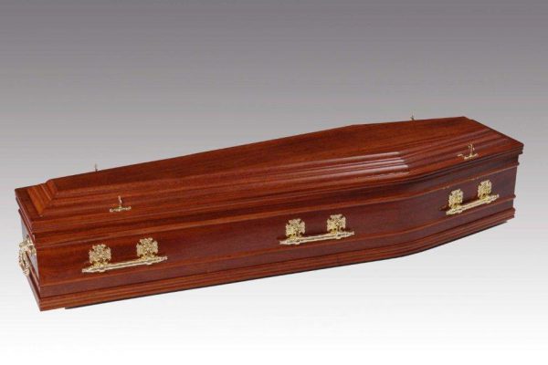 Mahogany veneered coffin with profiled features to coffin sides, fitted
with metal handles and a standard interior.